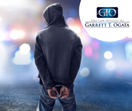 Man in hoodie handcuffs