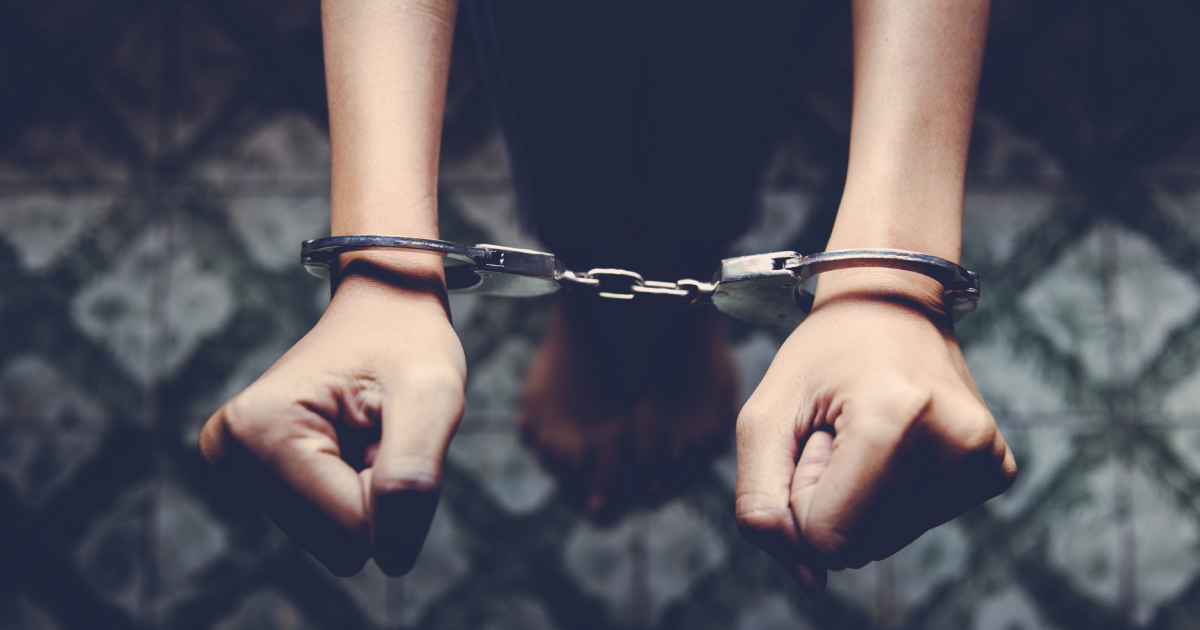 Hands in handcuffs, symbolizing crimes committed by Tourists